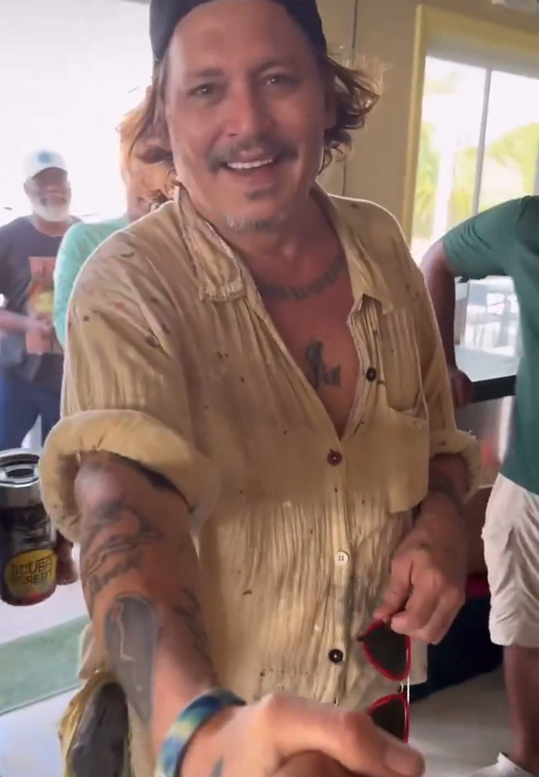 Johnny Depp flashes seemingly new pearly whites after his ‘rotting’ teeth went viral... See more